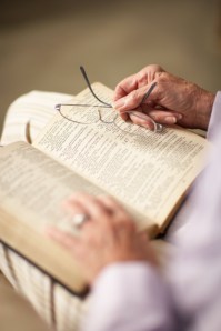 Old person reading Bible